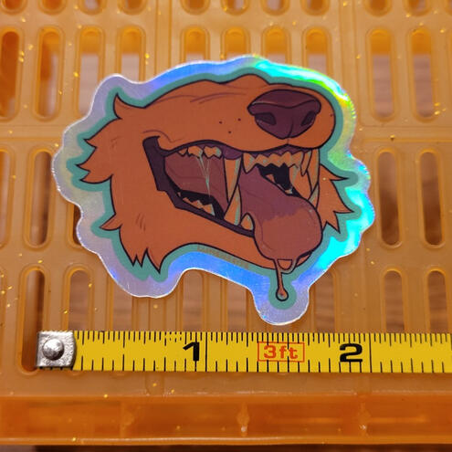 A photo of a holographic dog maw sticker.