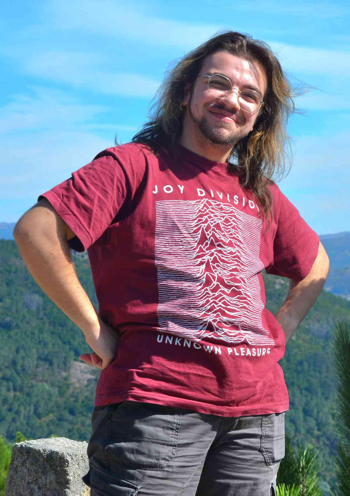 Photo of Rhidley, taken by MJSTY. A photo of Rhidley in natural lighting, looking confidently at the viewer with his hands on his hips.